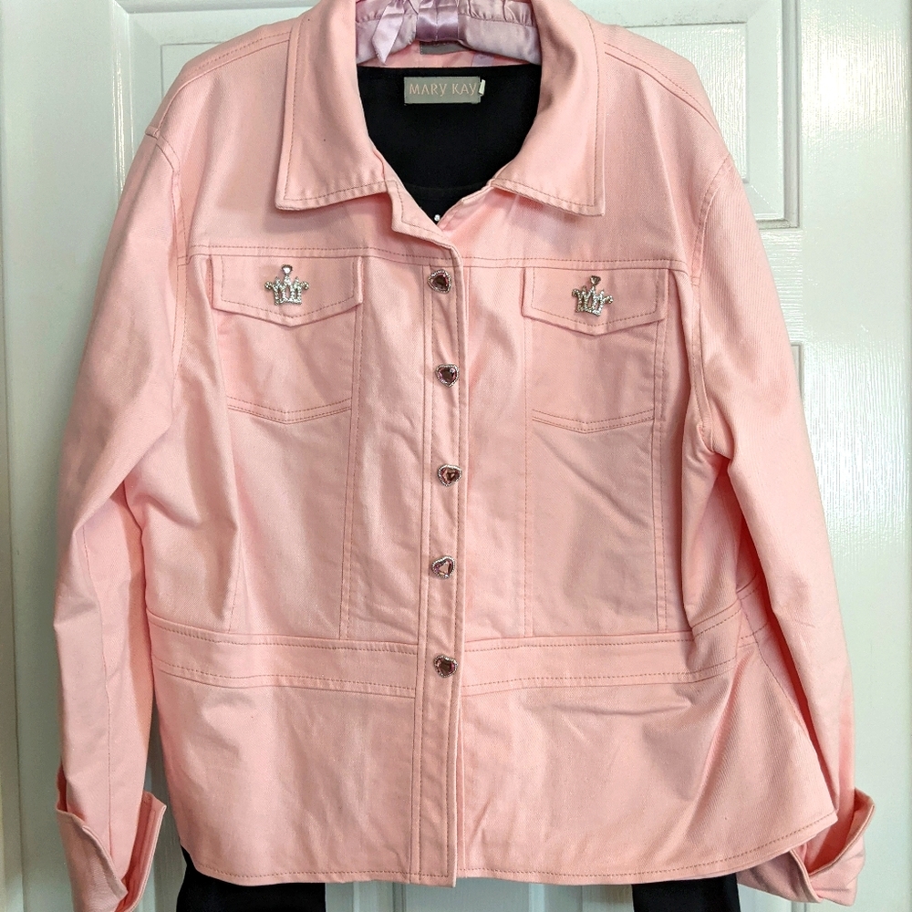 Mary Kay pink jacket with black shirt.